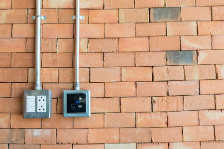 electric plug and wifi connector on the wallの写真素材