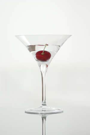 Martini glass with red cherryの写真素材