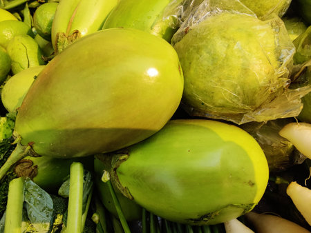 Green and yellow fruits and vegetables in the market, closeup of photoの写真素材