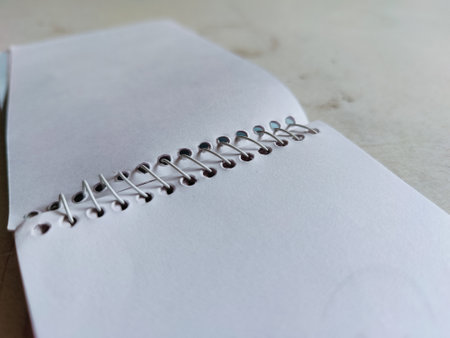 Notebook paper on wood table with copy space for add text.