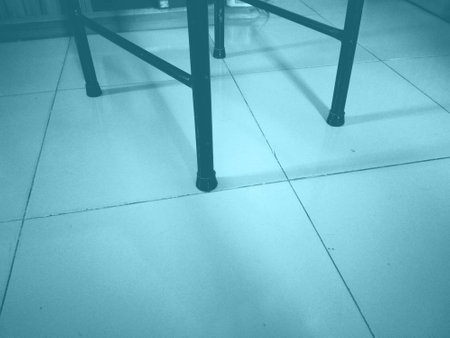 Metal chair on the floor. Toned blue.の写真素材