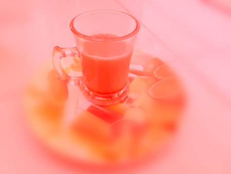 Orange juice in glass on table, closeup of photo with soft focusの写真素材