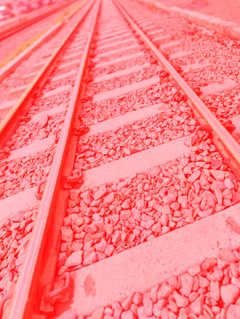 Railway track closeup in pink tone. Abstract background and texture.の写真素材