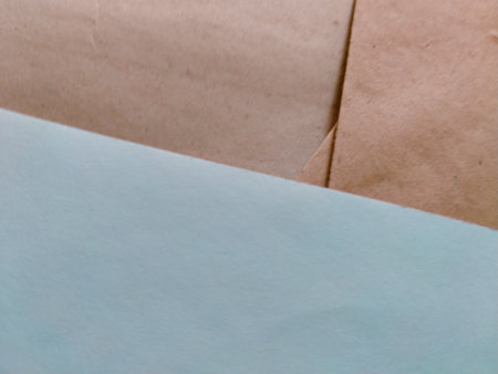 abstract background of crumpled paper in light blue and brown colorsの写真素材