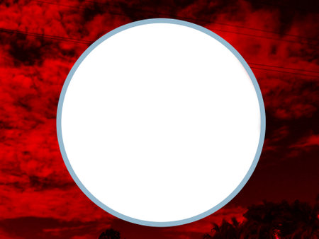 White circle frame on abstract red sky background. Copy space for your text.の写真素材