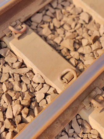 Railway, close-up of rails and sleepers on gravel
