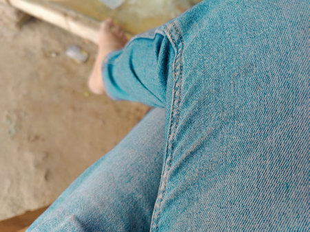 close up of a woman's legs in jeans