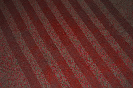 Red striped fabric texture for background. Toned in red color.の写真素材