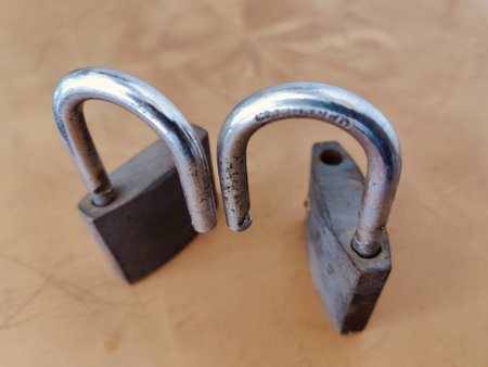Old rusty padlock on a brown background. Old padlock.