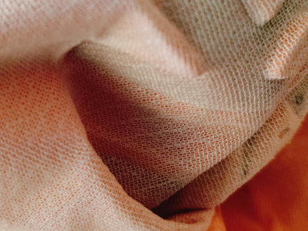 Texture, background, pattern. The fabric is knitted in pastel beige and white tones.の写真素材