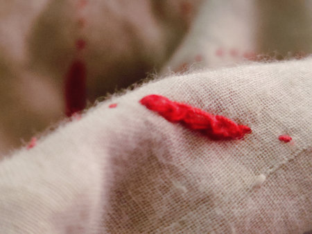 Texture of red fabric with spots and stains. Abstract background for design.の写真素材