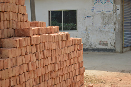 pile of bricks in construction site, brickwork is used for buildingの写真素材