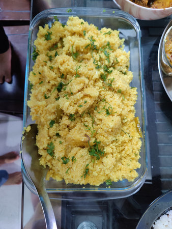 Couscous with chicken and vegetables in a plastic box.