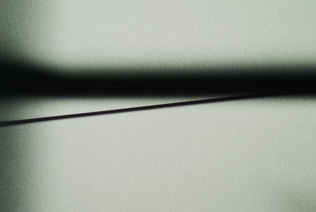 silhouette of shadow on a gray wall, closeup of photo