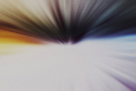 abstract background with rays of light and blurred spots of different colorsの写真素材