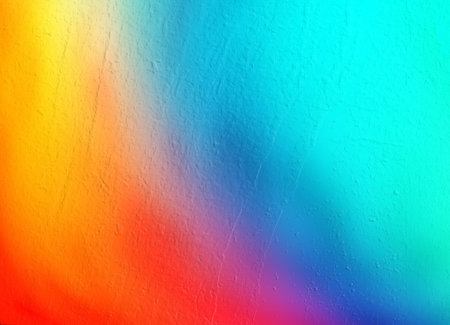 Vibrant blue red yellow background with soft grainy texture. The design is perfect for banners, posters, headlines and covers.の写真素材