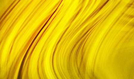 abstract yellow background with some smooth lines in it and some motion blur