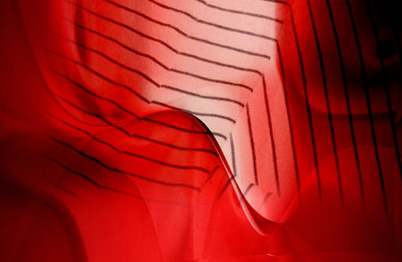 Abstract red background with stripes and lines, close-up view.の写真素材