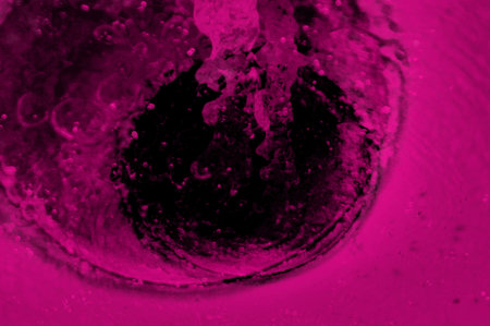 abstract pink background with some smooth lines in it and some water dropsの写真素材