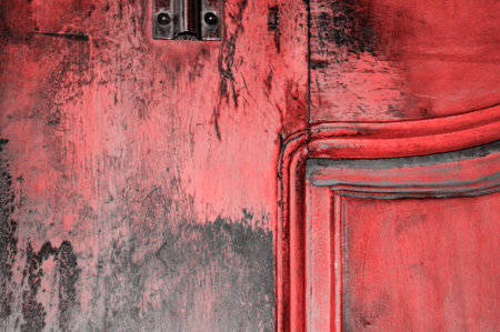 A cracked grunge rough wooden board with red hueの写真素材