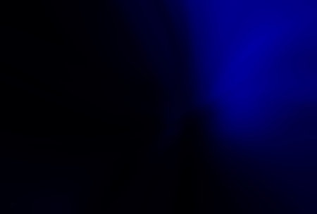 abstract dark blue background with some smooth lines in it and some spots on itの写真素材