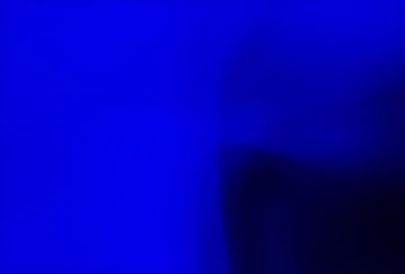 abstract blue background with some smooth lines in it and some spots on itの写真素材