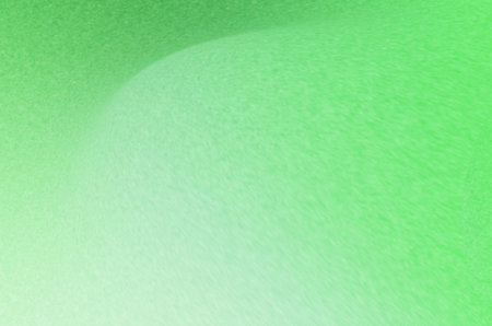 green abstract background with smooth lines in the center of the image.