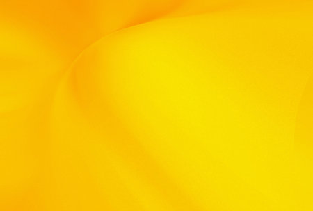 yellow satin fabric texture background. tissue, textile, cloth, fabric, material, textureの写真素材