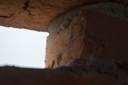 Brick wall with hole in the middle. Shallow depth of field.