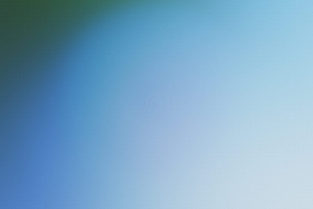 Blue textured background with a subtle gradient. The surface appears speckled, creating a soft...