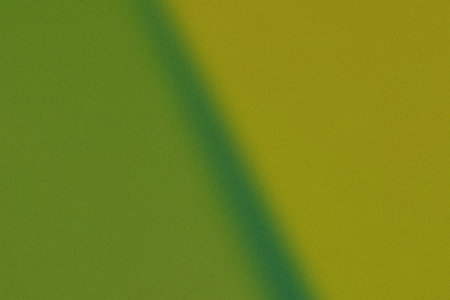 A textured, abstract green background featuring a gradient transition from lighter to darker shades....