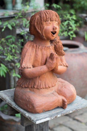 Clay sculptures saluting  womenの写真素材