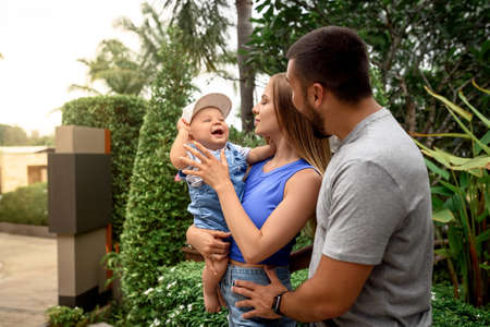 Family outdoors. family of three having fun and playing outdoors. happy family conceptの写真素材