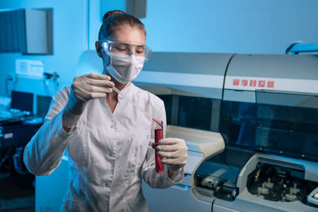 Woman scientist chemist working in modern laboratory