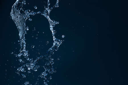 Water Splash On The dark blue background.の写真素材