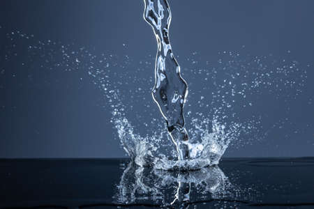 Water Splash On The dark blue background.の写真素材
