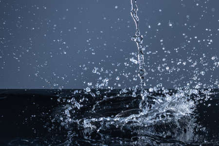 Water Splash On The dark blue background.の写真素材