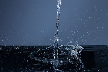 Water Splash On The dark blue background.の写真素材