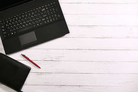 Top view: stationery on a white desk