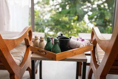 cold towel and tea cup on the tray at spa area.の写真素材