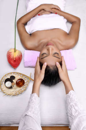 Mixed race girl on spa treatments in luxury salonの写真素材