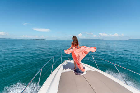 Luxury girl relaxes on her private yachtの写真素材
