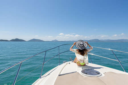 Luxury girl relaxes on her private yachtの写真素材