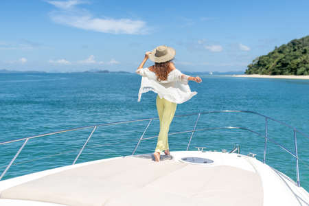 Luxury girl relaxes on her private yachtの写真素材