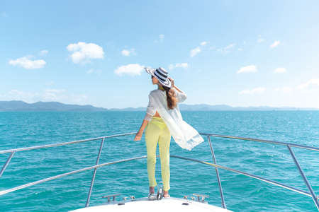 Luxury girl relaxes on her private yachtの写真素材