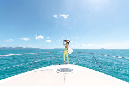 Luxury girl relaxes on her private yachtの写真素材