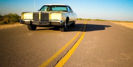 Old Car Parked at the side of the road in the Arizona Desertの写真素材