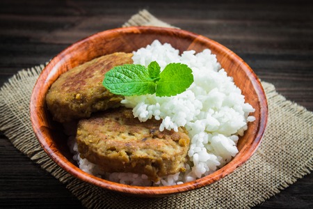 Cutlets with white rice in a bowl.の写真素材
