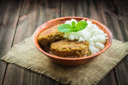 Cutlets with white rice in a bowl.の写真素材