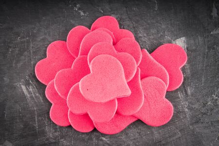 red and pink hearts on grey backgroundの写真素材